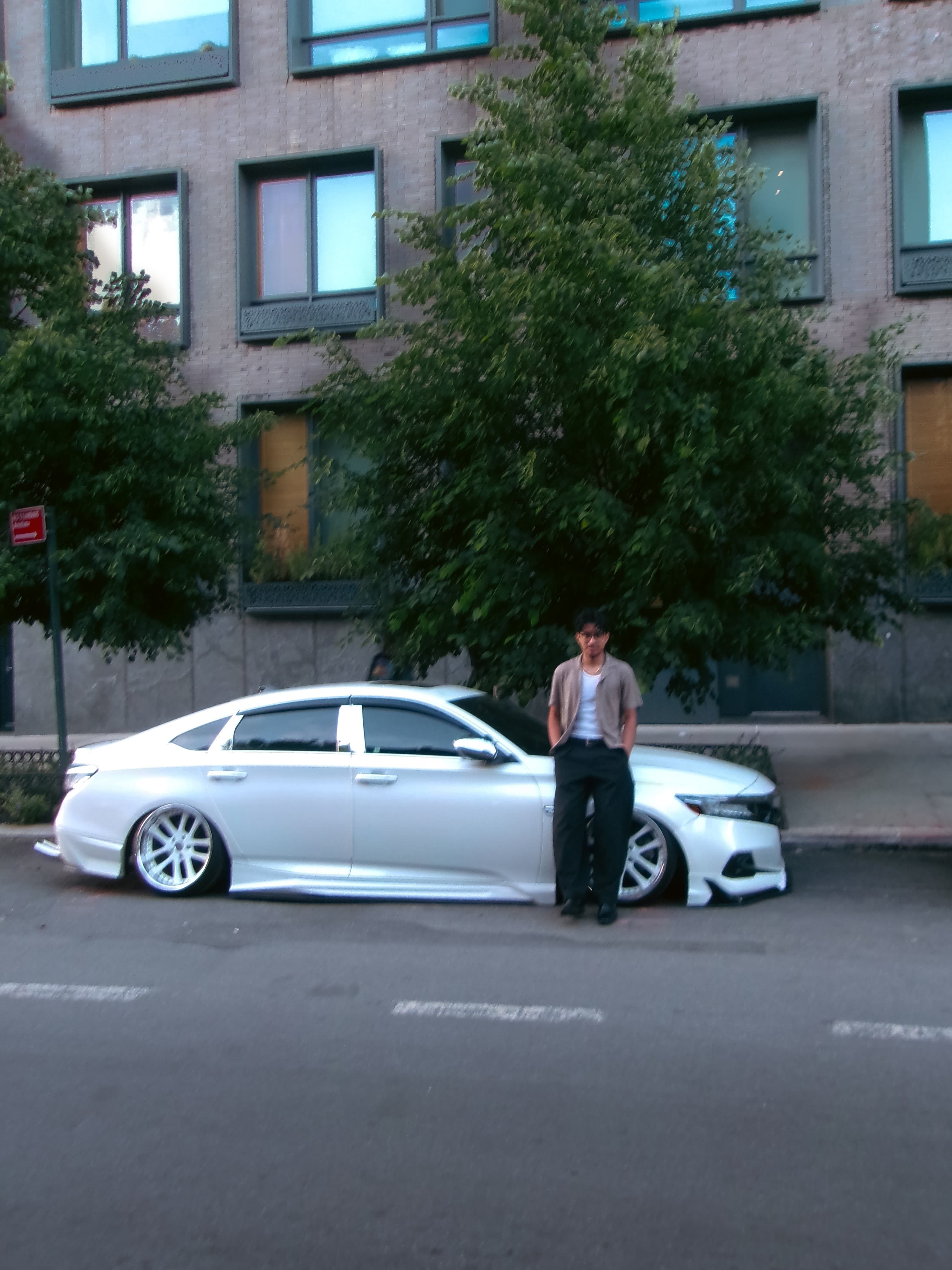 Jossue standing beside his Honda Accord